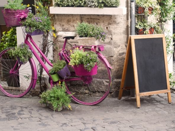 bistro store front with pink bicycle and chalk board