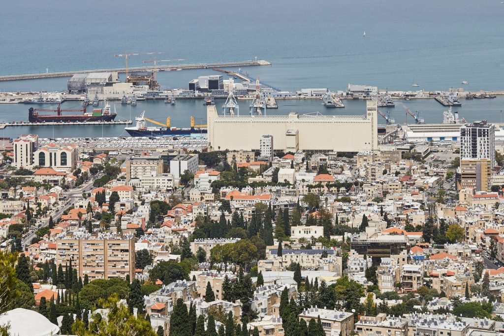 Seaport in the city of Haifa, panorama of the port and city buildings against the background