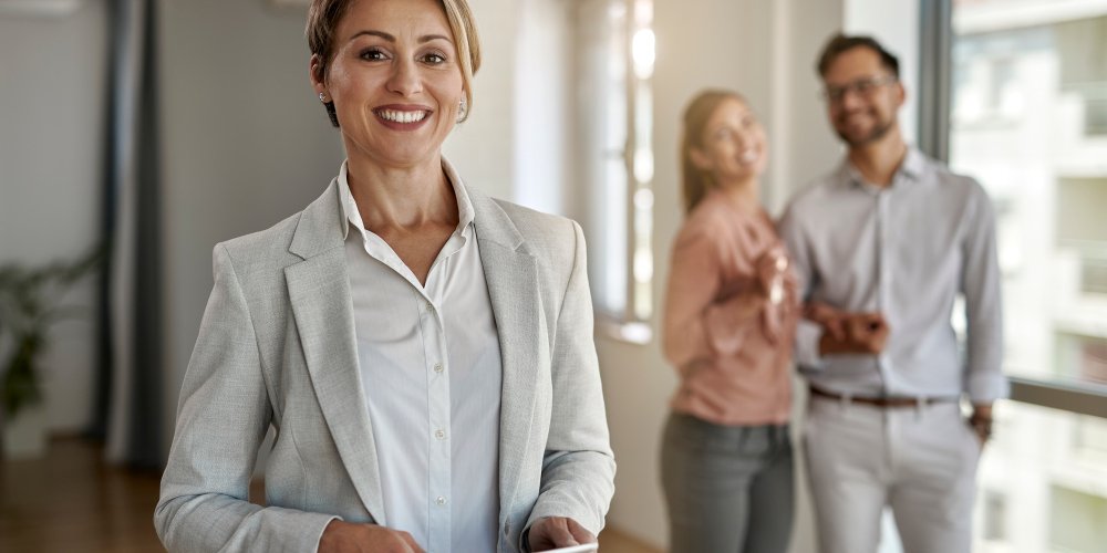 Portrait of happy female real estate agent.